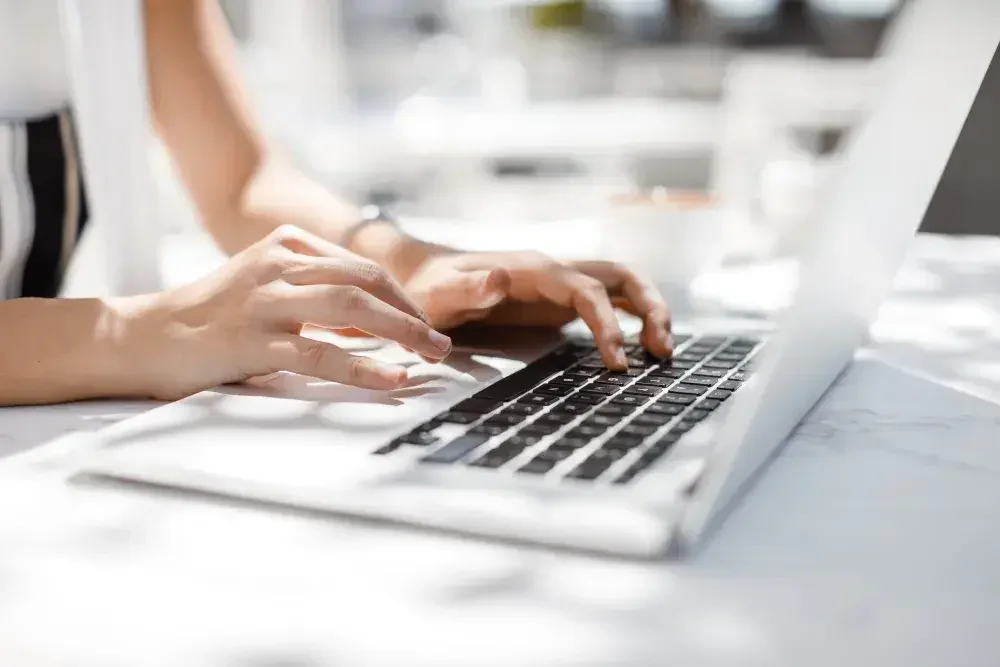 A person types on a laptop and forms an LLC that will be based in their home state. When you form an LLC in the state where your business operates, you only have one set of legal and tax requirements to worry about and only one annual reporting fee.